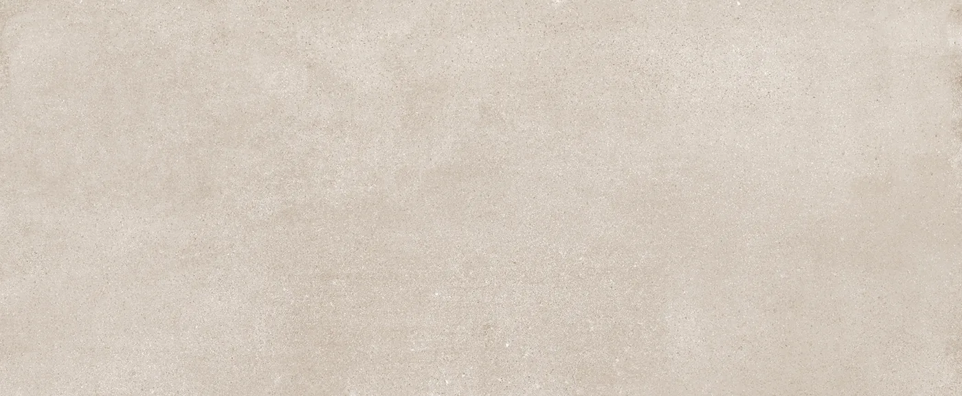 Graubeige Wandfliese 20×50 cm mit gleichmäßig durchgefärbter Fläche und feiner Körnung im Betonlook.