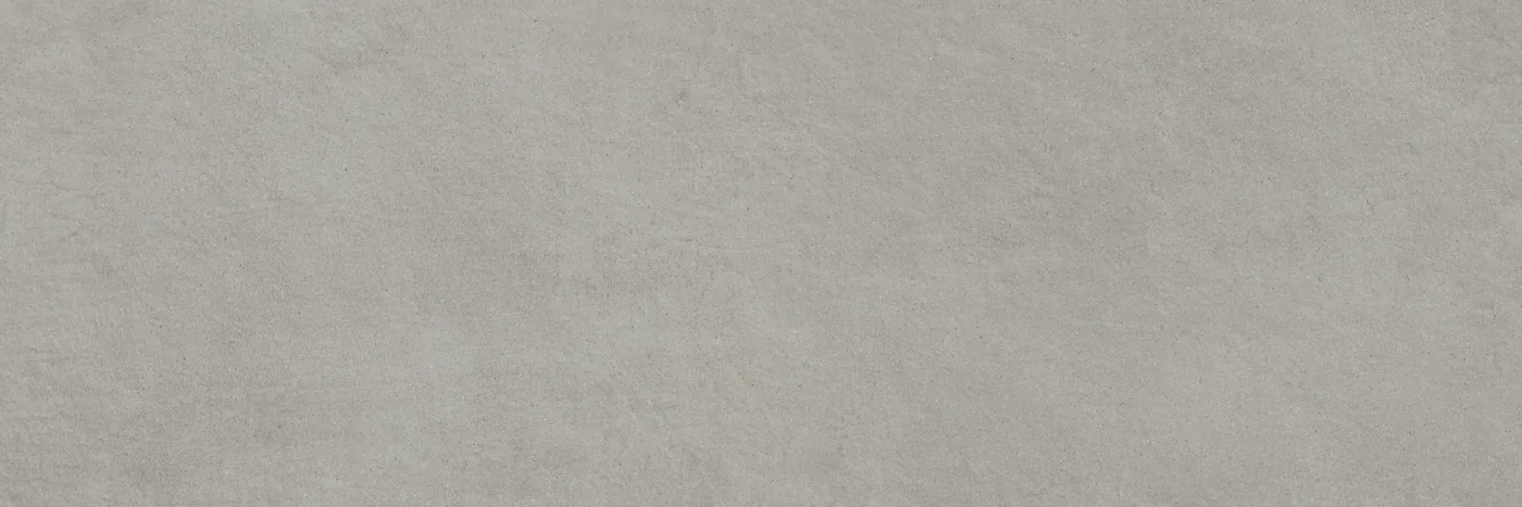 Mittelgraue Wandfliese im Querformat 40×120 cm mit matter Betonoptik, leichter Wolkung und feiner Körnung