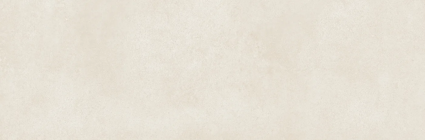 Sandfarbene Wandfliese 25×76 cm mit gleichmäßig durchgefärbter Fläche und feiner Körnung im Betonlook.