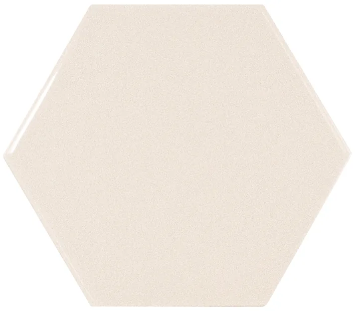 Sechseckige Wandfliese in Creme, glänzend glasiert, Format 12,4x10,7 cm, mit gleichmäßig deckender, blickdichter Oberfläche.