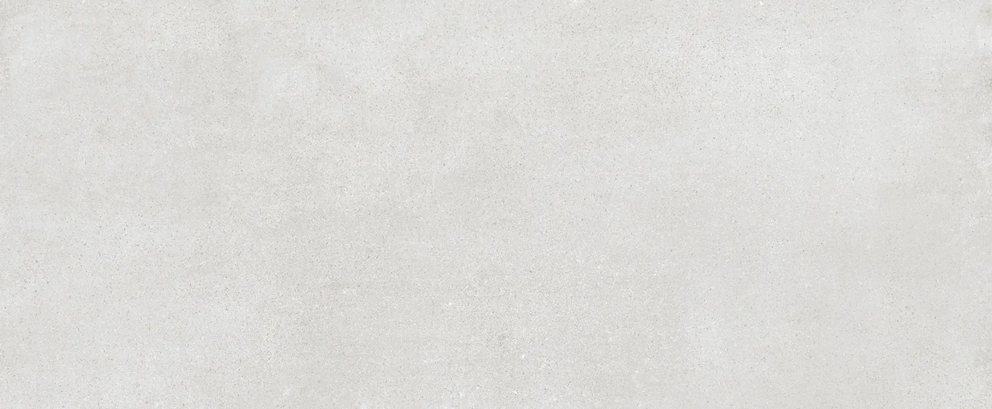 Hellgraue Wandfliese 20×50 cm mit gleichmäßig durchgefärbter Fläche und feiner Körnung im Betonlook.