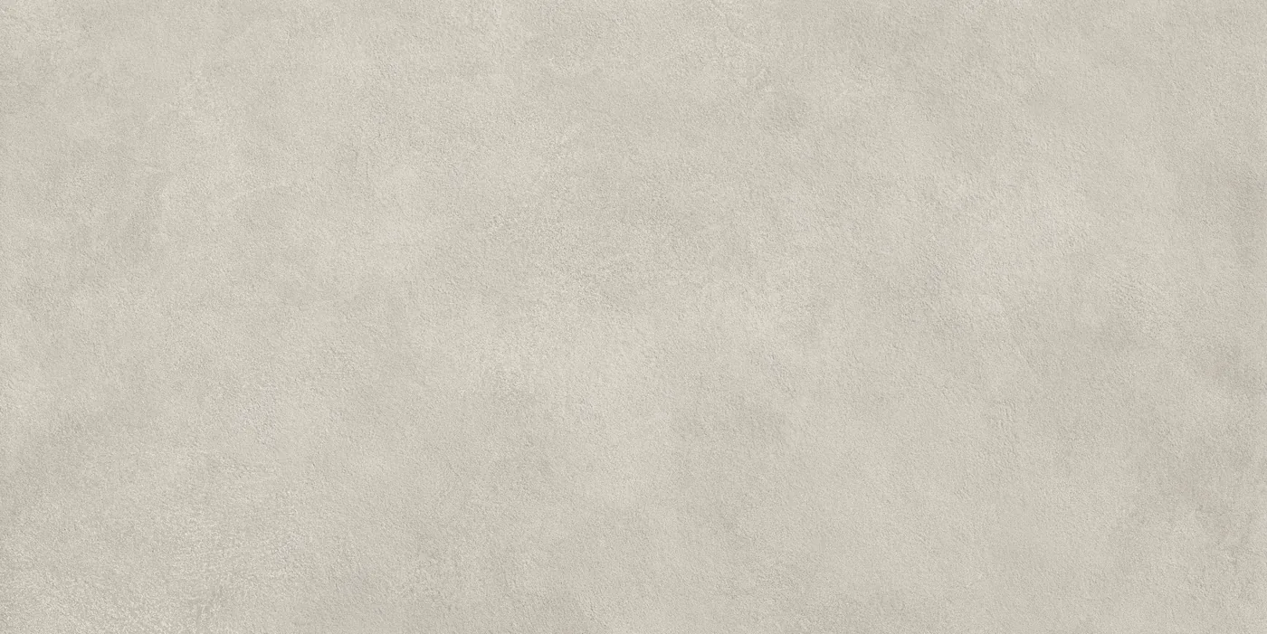 Salbeigrüne Betonoptik-Fliese 60×120 cm, matt, mit weicher wolkiger Struktur über die Fläche.