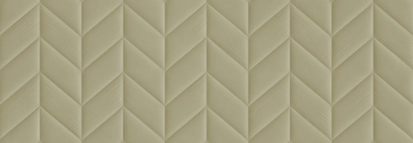 Salbeigrüne matte Wandfliese 30×90 cm mit plastischem Fischgrätrelief Ton in Ton, frontal aufgenommen.