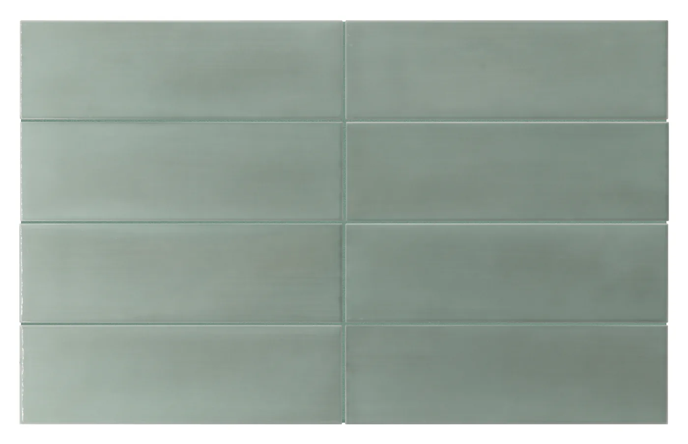 Glänzende salbeigrüne Wandfliese im Metroformat 6,5×20 cm mit wolkiger Lasur und zartem Graugrün-Schimmer.