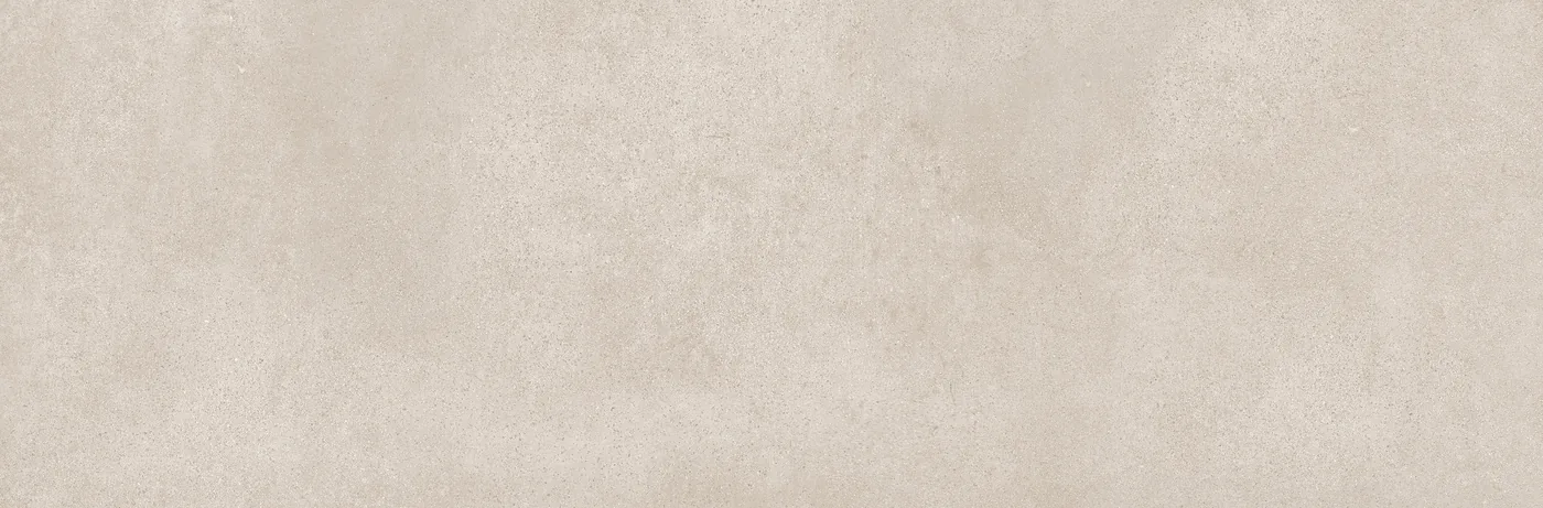 Graubeige Wandfliese 25×76 cm mit gleichmäßig durchgefärbter Fläche und feiner Körnung im Betonlook.