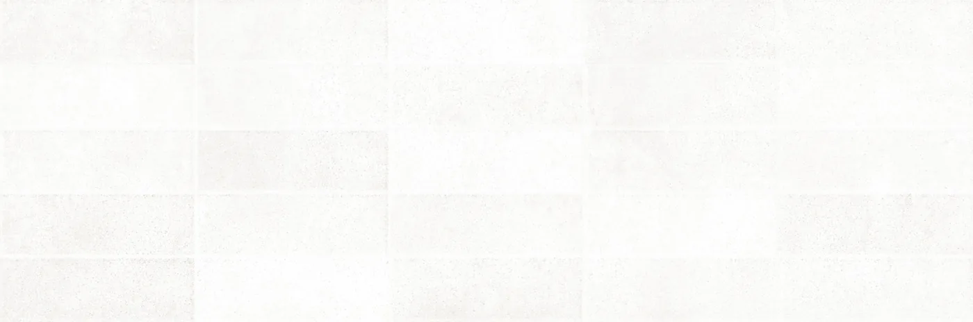 Weiße Wandfliese 25×76 cm mit reliefartigem Raster aus versetzten, leicht erhabenen Rechtecken.