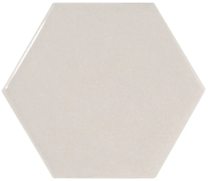 Sechseckige Wandfliese in Hellgrau, glänzend glasiert, Format 12,4x10,7 cm, mit gleichmäßig deckender Oberfläche.