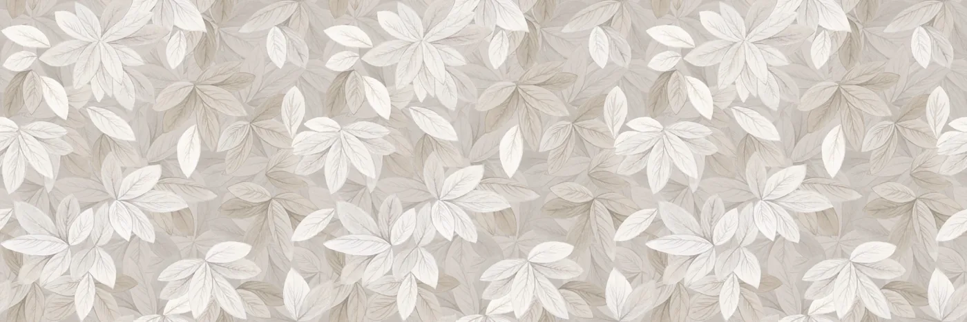 Wandfliese im Langformat mit dicht gestreuten hellen Blättern in Weiß, Greige und Beige auf hellem Grund.