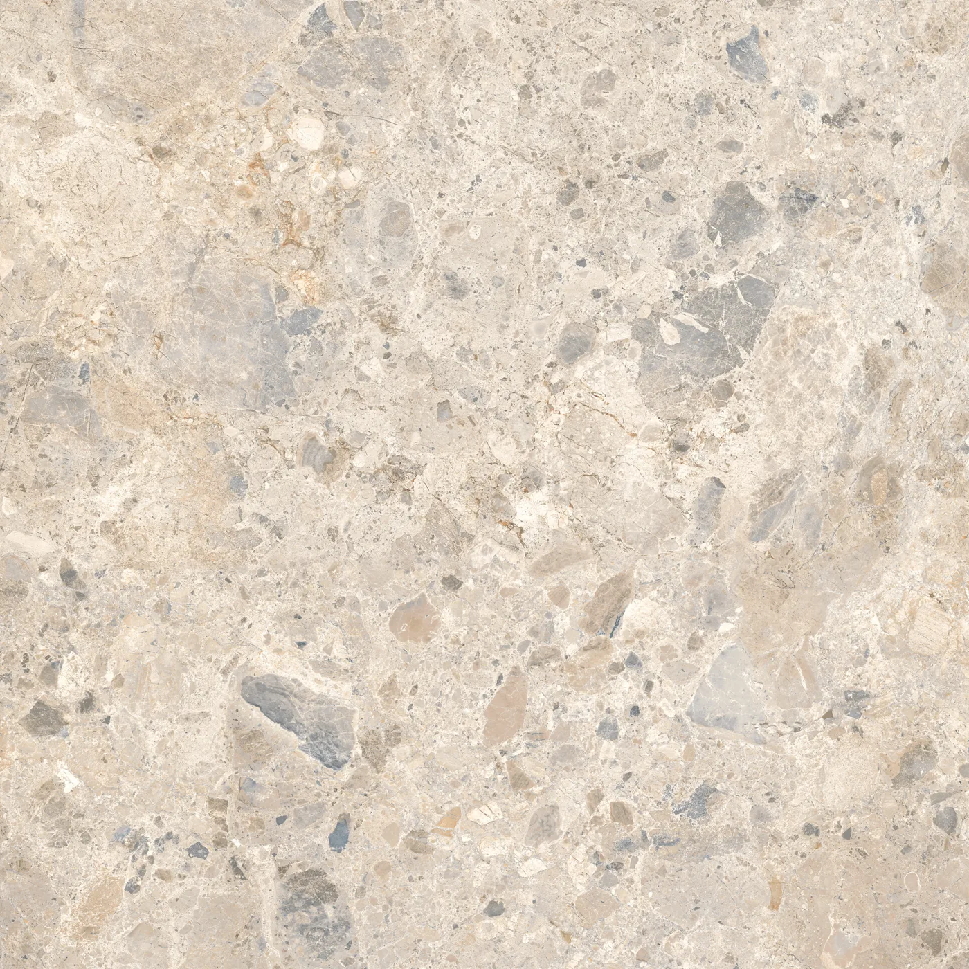 Cremefarbene Fliese 100×100 cm in Terrazzo-Optik mit beigen, grauen und braunen Steinsplittern unterschiedlicher Größe.