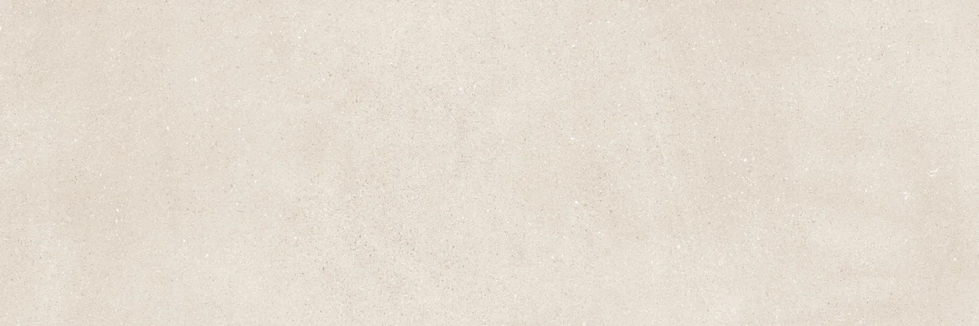 Rechteckige Wandfliese in hellem Cremebeige mit feiner Betonstruktur, dezenten Sprenkeln und matter Oberfläche, Querformat