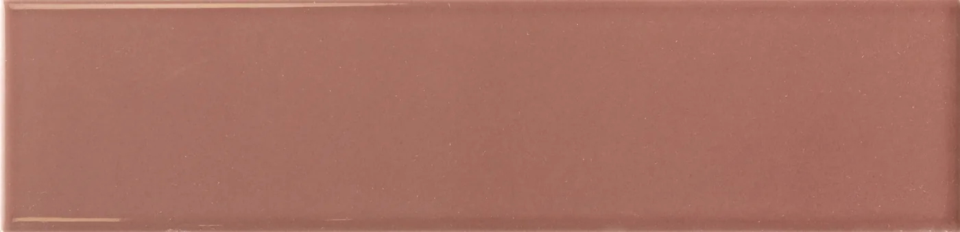Rechteckige Wandfliese in warmem Ziegelrot, glänzend, glatte einfarbige Oberfläche, im Format 6x24,6 cm.