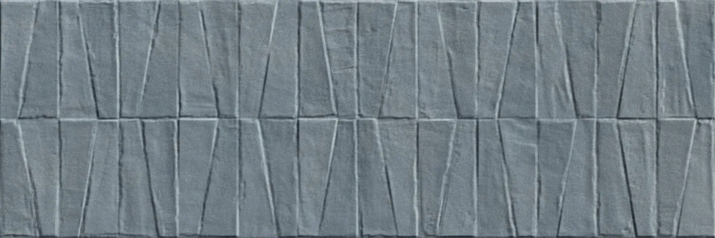 Graublaue Wandfliese 40×120 cm mit dreidimensionalem Relief aus versetzten Trapezen in matter Betonoptik