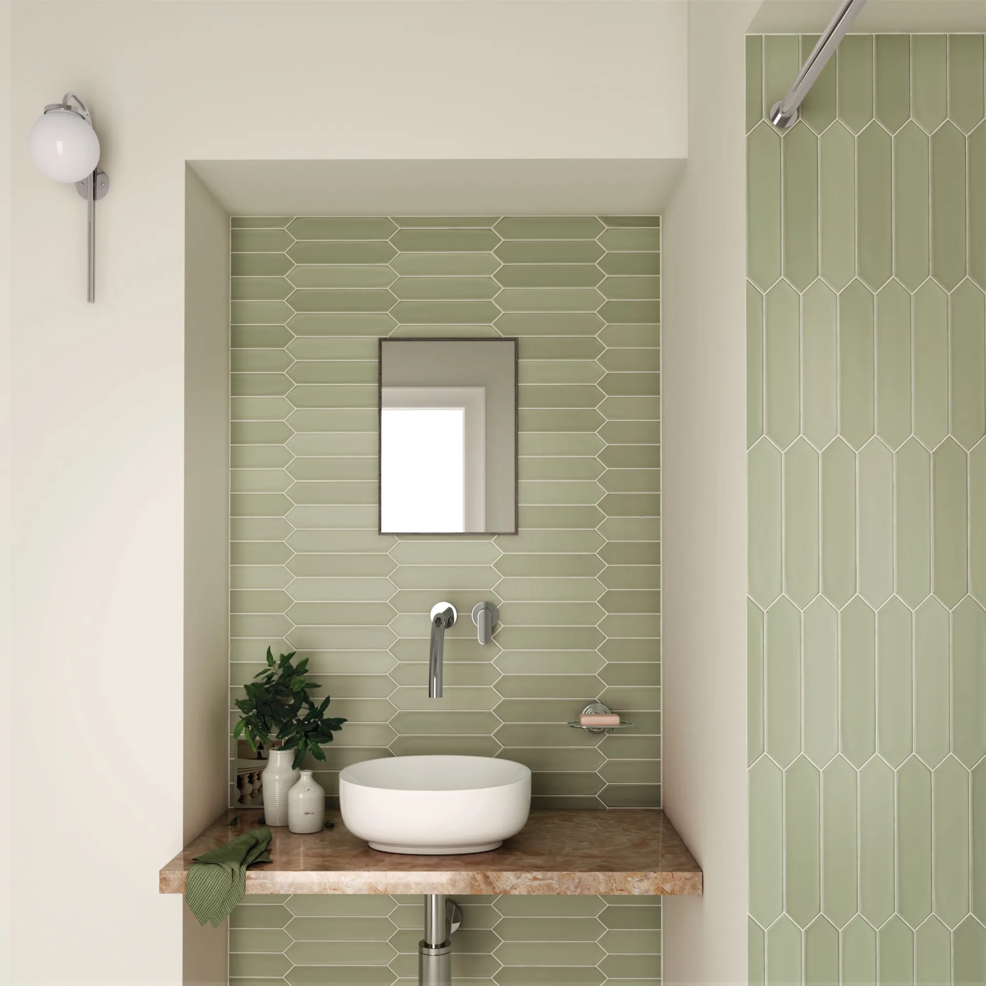 Gäste-WC mit mintgrünen, spitz zulaufenden Wandfliesen, Aufsatzbecken auf Holzablage und schmalem Spiegel.