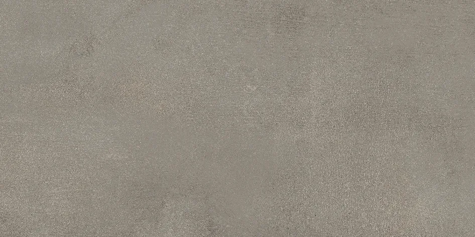 Nahaufnahme der Oberflaeche in matter Betonoptik mit feiner Struktur und leichter Koernung.