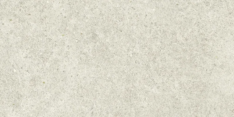 Helle, beigeweiße Steinoptik mit feiner Maserung und leicht porösem, rauem Oberflächen-Detail.