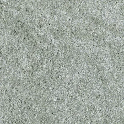 Nahaufnahme einer beige-warmen Steinoberfläche mit cremiger, fein strukturierter Maserung.