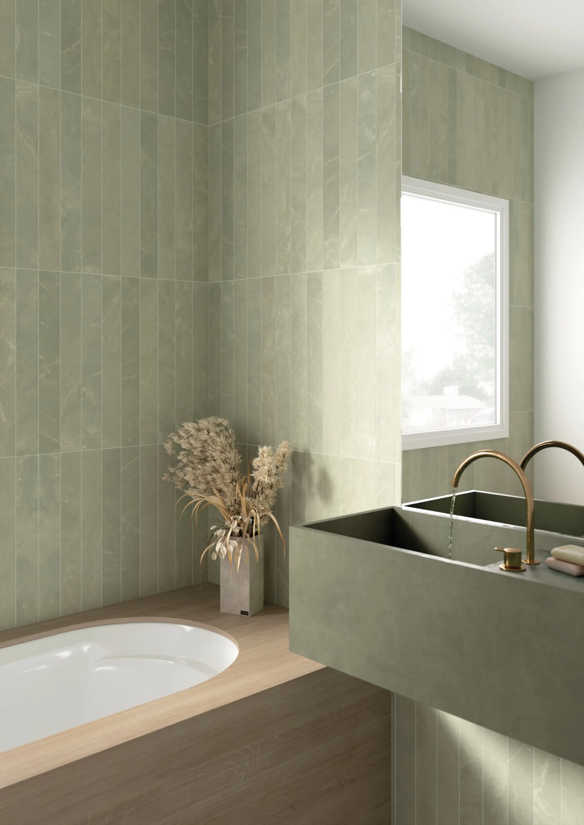 Equipe Marmoris Matcha als Badwand: salbeigruene Riemchen an Wanne und Waschtisch mit goldener Armatur.